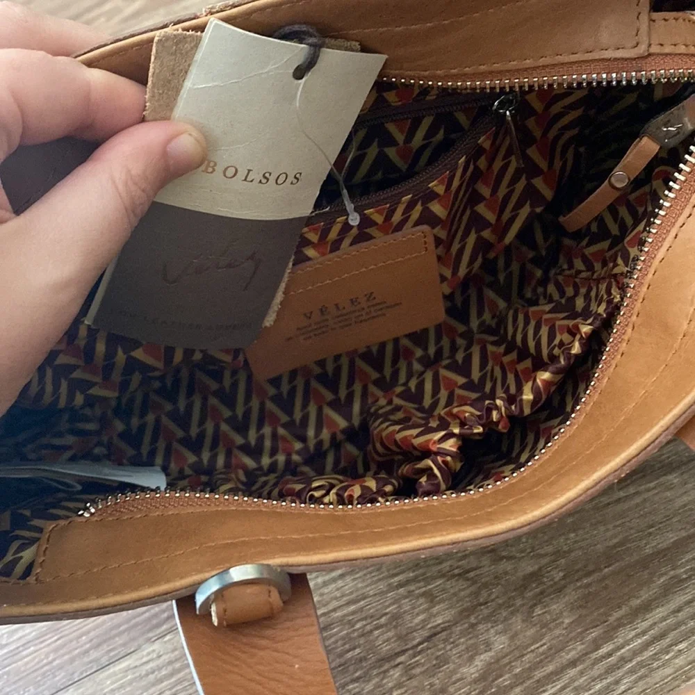 New with tags inside Leather Velez Columbia satchel w/crossbody strap Camel